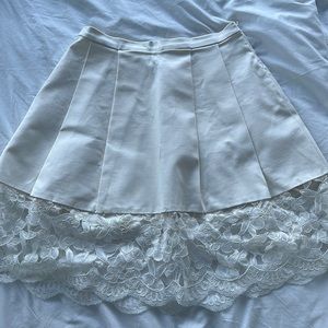 White ruffle skirt with white lace embroidery